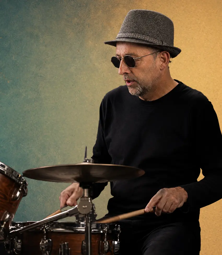 Greg Lindner playing his cut down drum kit on stage